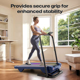 UREVO Walking Pad Handrail: Woman using the handrail for secure grip and stability during walking exercise